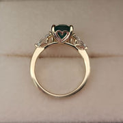 3 stone ring- 2.81 carat green emerald and 0.50 carat diamond on the side
