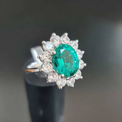 green emerald ring with diamond white gold