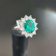 green emerald diamond engagement ring