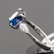 blue oval sapphire with 2 marquise cut diamonds ring