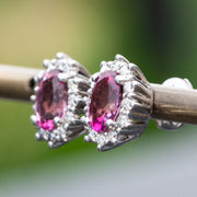 aretes de topacio rosa con diamantes