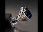 Elizabeth - 26.00 carat oval sapphire ring with 1.20 carat natural diamonds