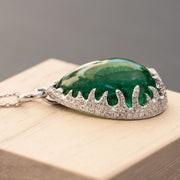 25.60 carat natural green emerald pendant with 0.65 carat natural diamond