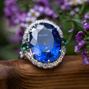 Juliana - 25.00 ct oval sapphire ring with 0.30 natural green emeralds and 1.10 carat natural diamonds